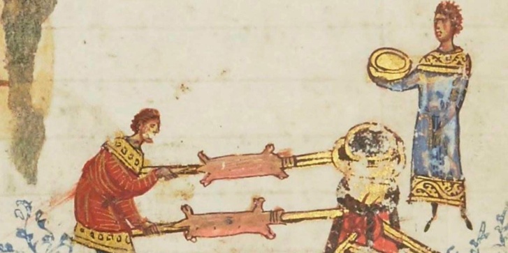 Σκηνή με τον «υπέρ την πυράν ψηνόμενο οβελία» από χειρόγραφο του 11ου αιώνα.