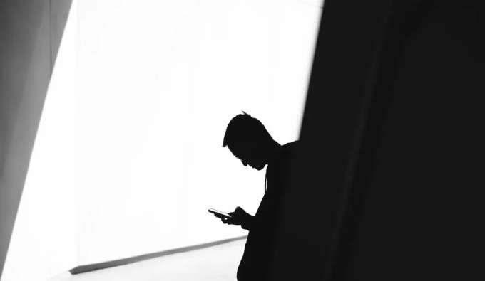 Man looks at his phone
