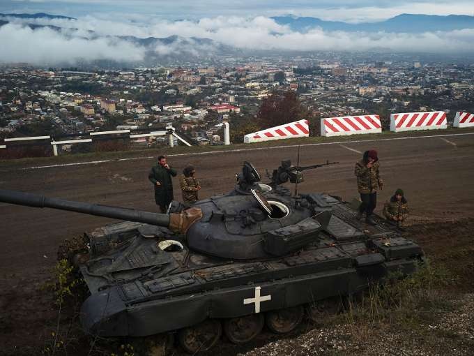 Soldiers guard a road in Stepanakert, Nagorno-Karabakh, in 2020