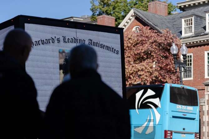 A billboard truck displayed the names and faces of Harvard students who were linked to an anti-Israel letter. 