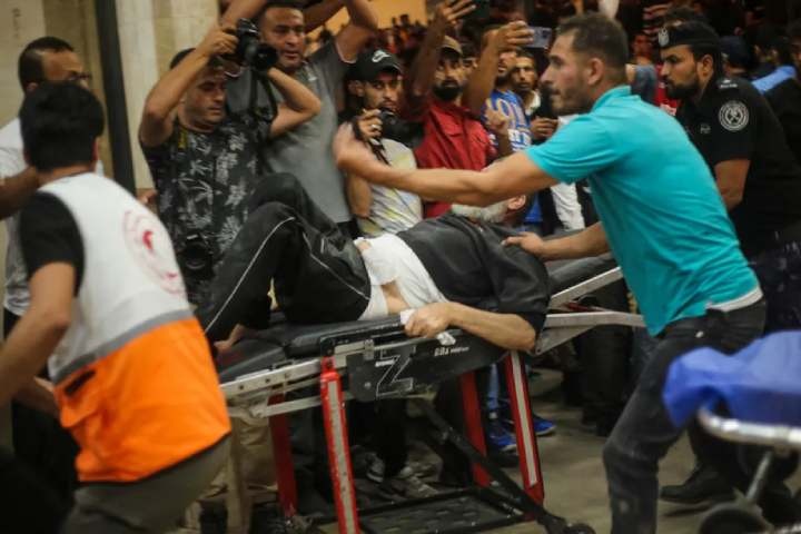 Palestinians injured during Israeli raids are treated at Nasser Hospital in the city of Khan Younis, in the southern Gaza Strip, on October 14, 2023