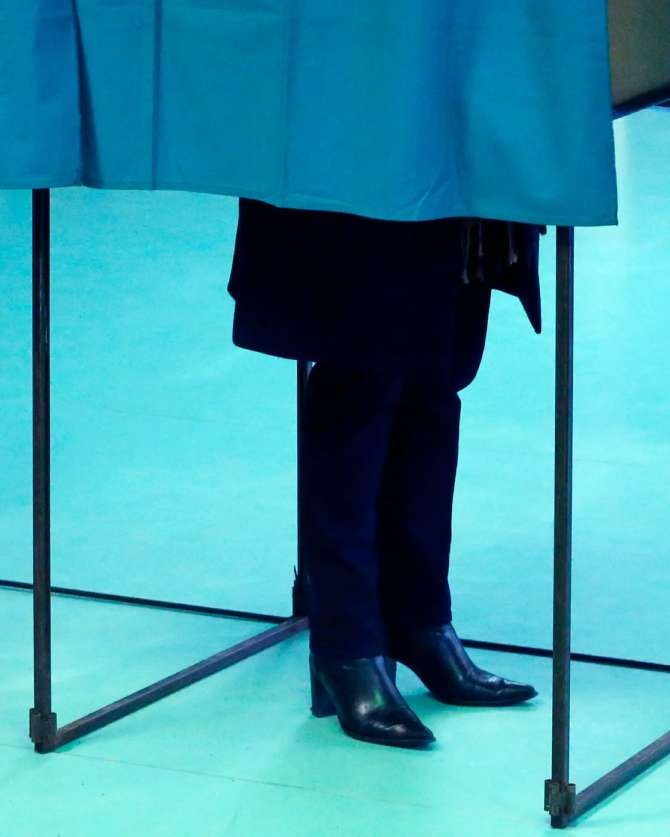 Man in voting booth