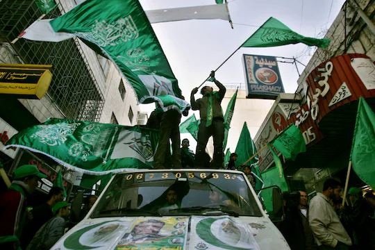 Palestinian supporters of Hamas gather for a pre-election rally in the West Bank town of Ramallah on Jan. 23, 2006.