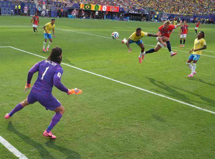 Erling Haaland scores Norway’s first goal against Brazil by showing the aerial prowess he honed as a child playing handball. 