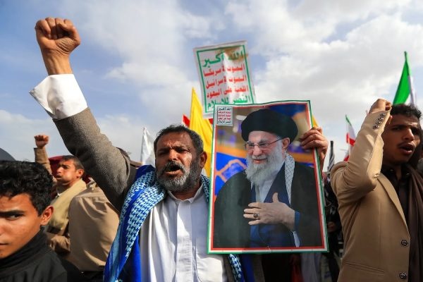 A protester holds a portrait of former Iranian Supreme Leader Ayatollah Ali Khamenei in Sana’a, Yemen, on July 10. Mohammed Huwais/AFP via Getty Images