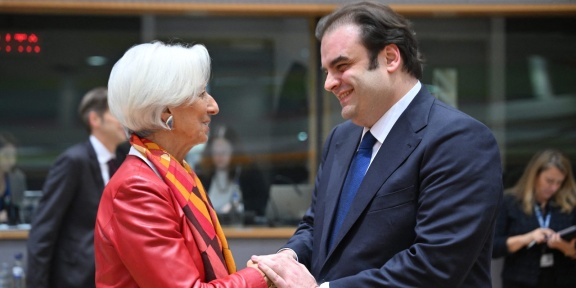 European Central Bank President Christine Lagarde (L) and Greek Minister of Economy and Finance Kyriakos Pierrakakis (R) attend a meeting of Eurozone finance ministers at the European Commission in Brussels, Belgium on December 11, 2025, to elect the new Eurogroup President and review the euro areaâ€™s budget outlook. Dursun Aydemir / Anadolu (Photo by Dursun Aydemir / ANADOLU / Anadolu via AFP)